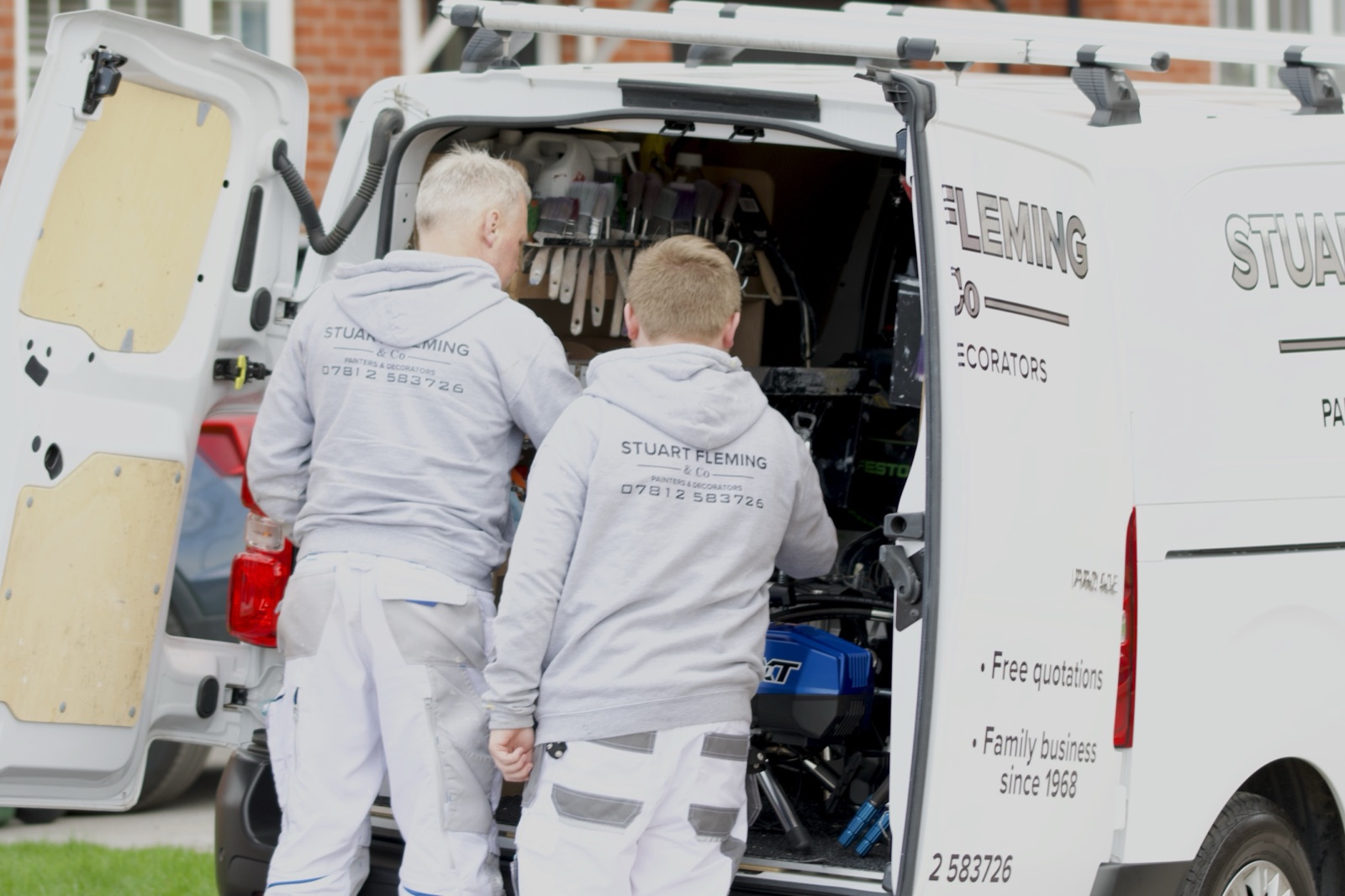 Stuart and Daniel Fleming getting tools from their work van